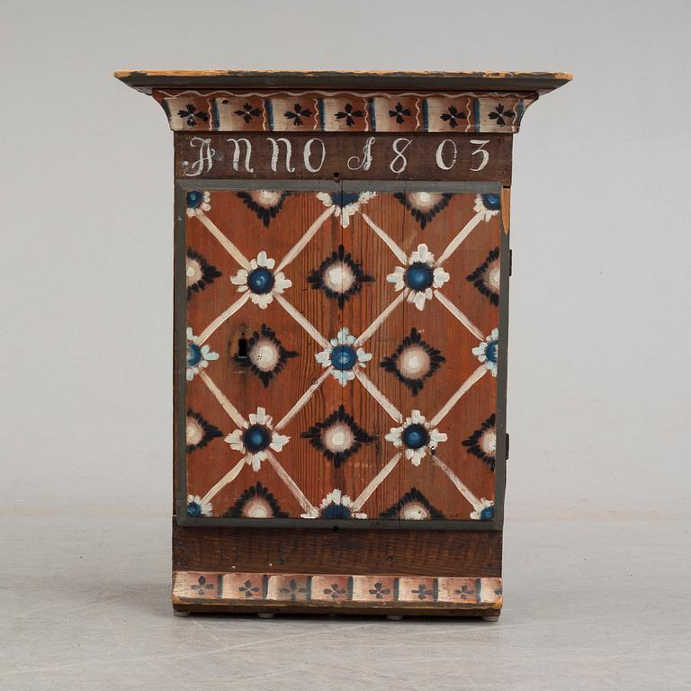 An early 19th century wall cabinet.