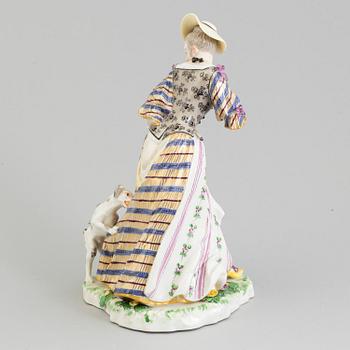 A Nymphenburg porcelain figure of a lady with a dog, Germany, 20th Century.