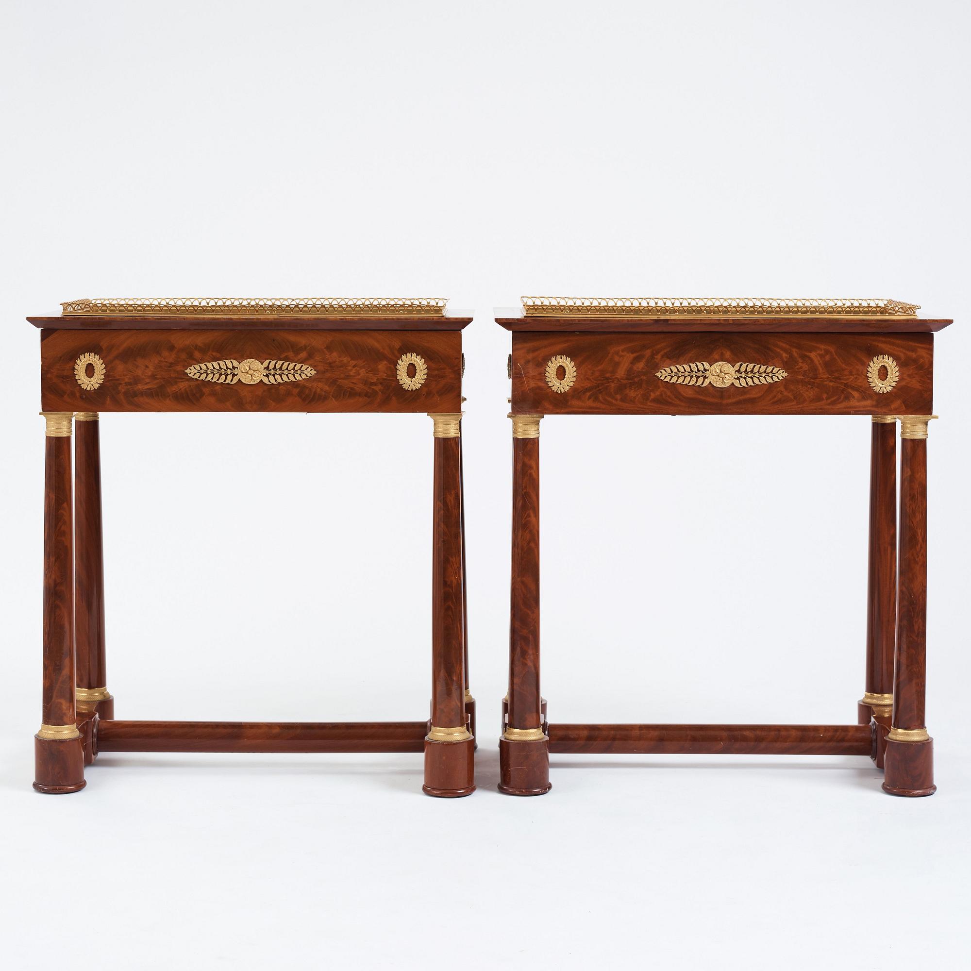 A pair of French Empire gilt bronze-mounted mahogany jardinieres, first half of the 19th century.