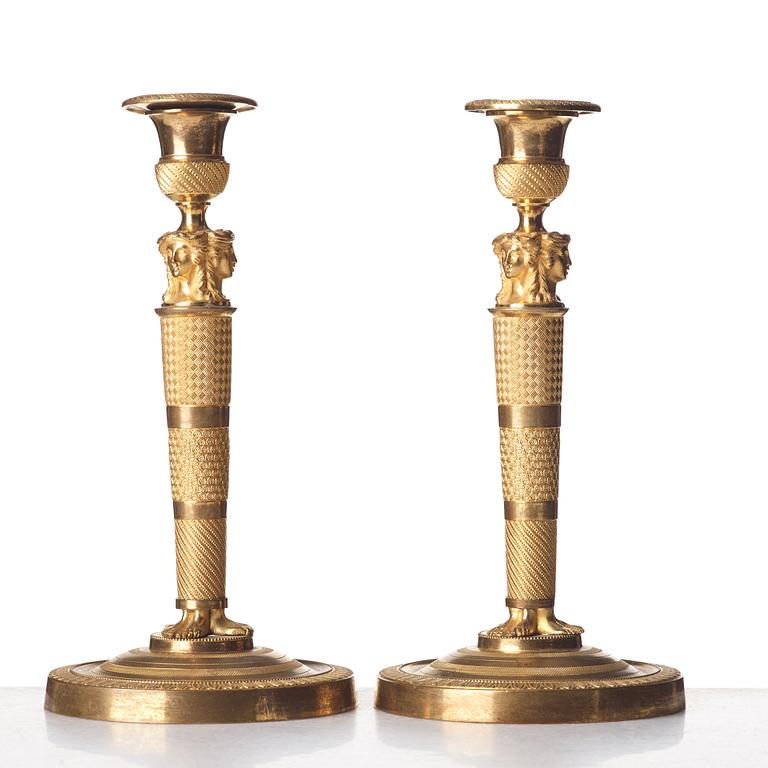 A pair of French Empire candlesticks, early 19th century.