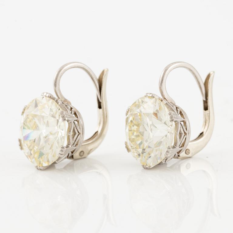 A pair of earrings in 18K white gold set with two old-cut diamonds.