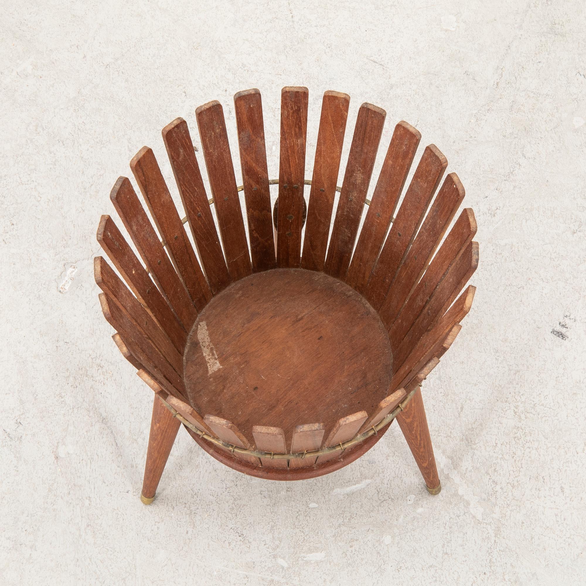 A 1950s teak wastepaper basket.