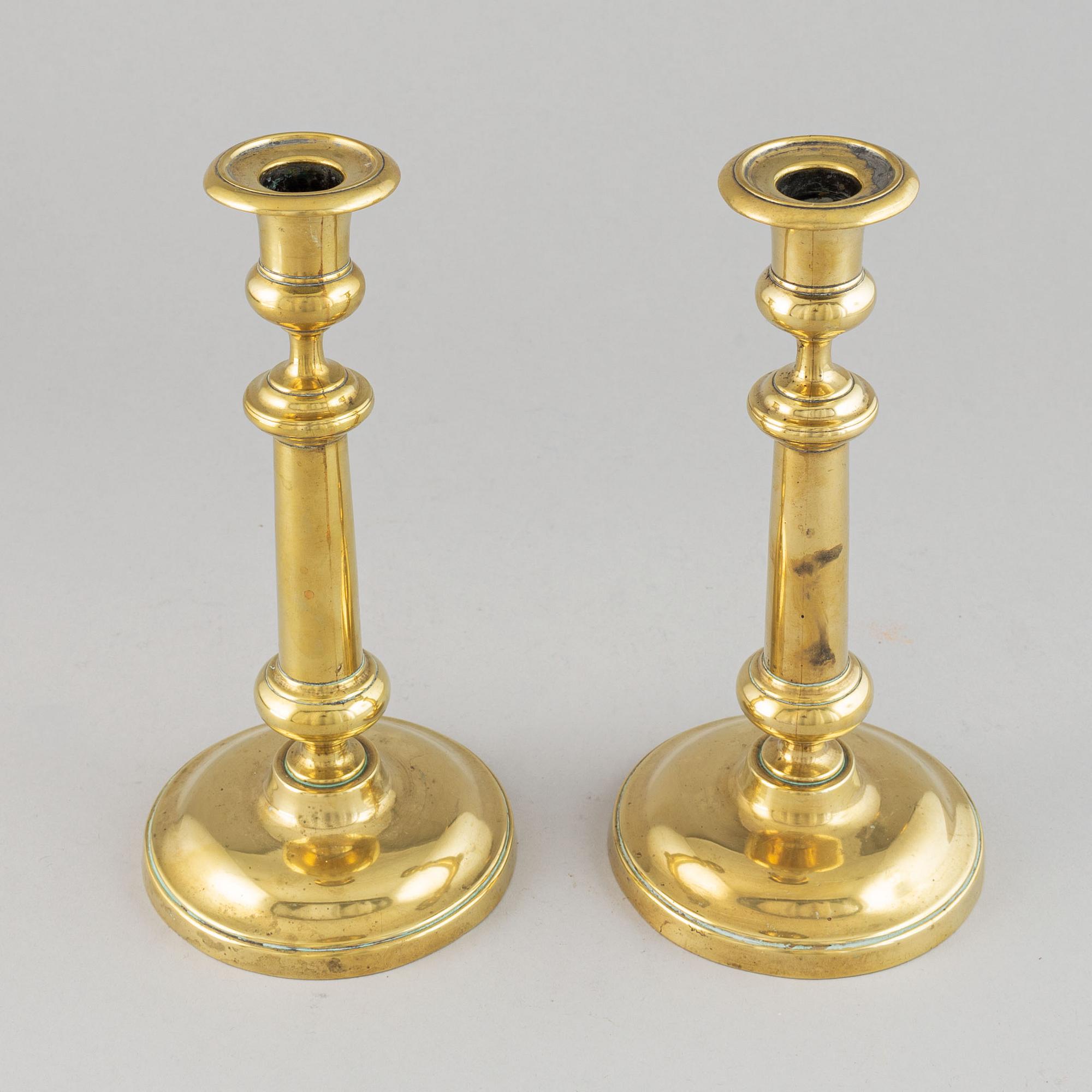 A pair of bronze Rmpire candlesticks, first half of he 19th century.