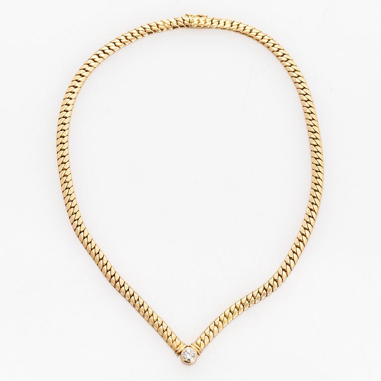 Collier, 18K guld och en briljantslipad diamant.