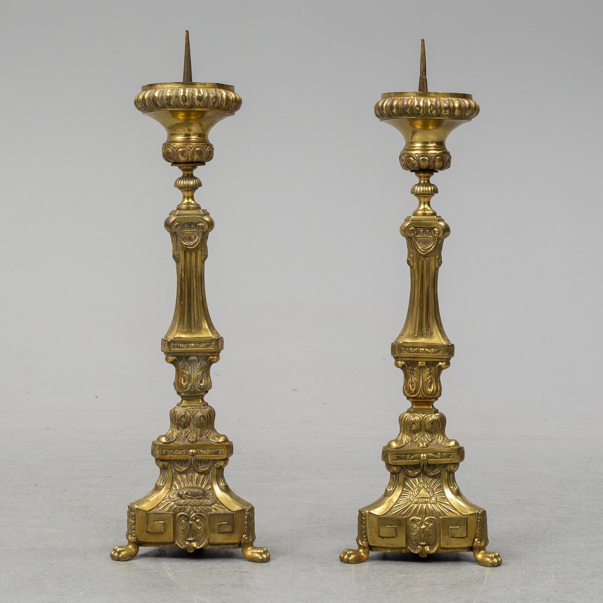 A pair of 18th century brass floor candlesticks.