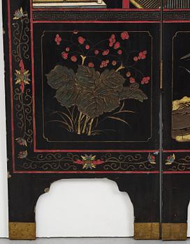 A Chinese four panel lacquer folding screen, first part of the 20th century.