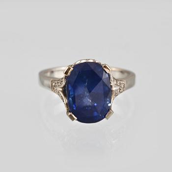 929. A sapphire, 5.71 cts and diamond ring.