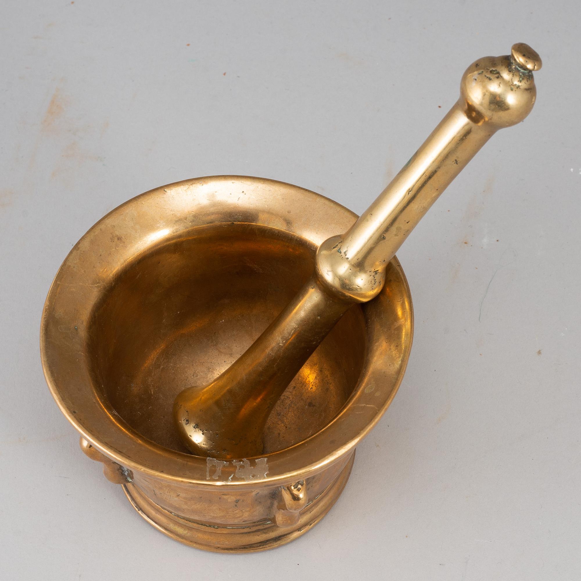 A 17th century bronze mortar and pestle.