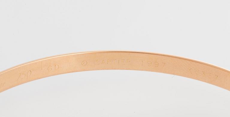 A Cartier "Trinity" bangle.