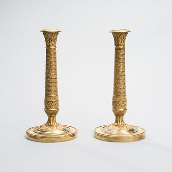 A PAIR OF CANDLESTICKS, gilt bronze, France fists half of the 19th century.