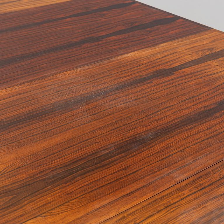 A 1950s/1960s rosewood veneer table.