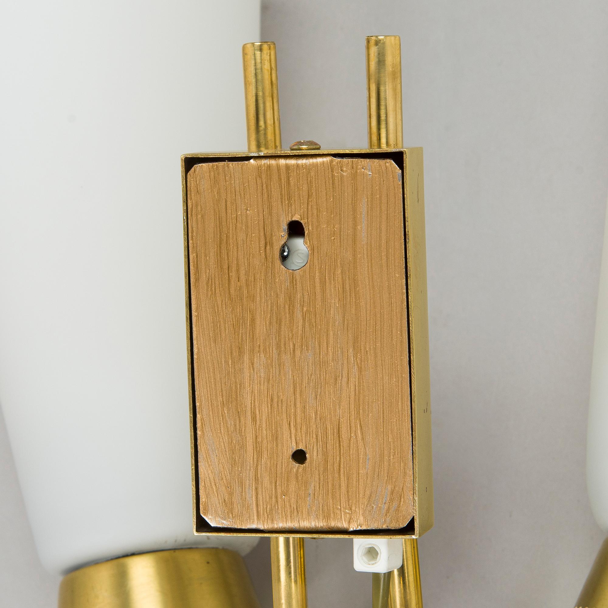 A pair of mid-20th century wall lights, model EY60, Itsu, Finland.