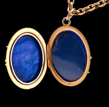 MEDALJONG, flerfärgsguld, rubiner, cabochonslipad safir 4,5 x 3,5 mm.