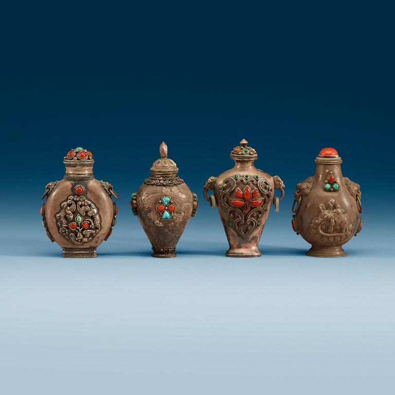 A set of four Tibetan snuff bottles with stoppers, ca 1900.