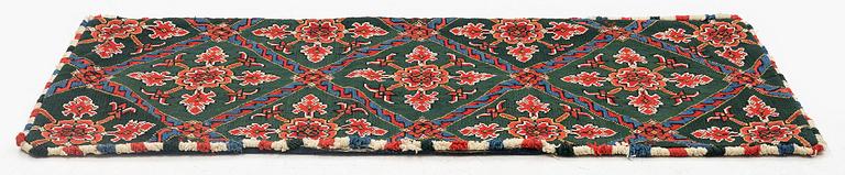 A carrige cushion, embroidered, 122 x 52 cm, Scania, dated 1830.
