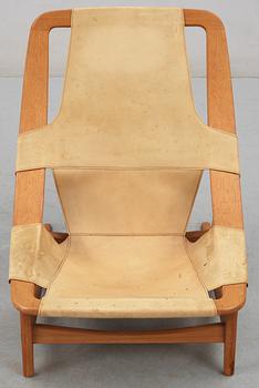 An Arne Tidemand Ruud teak and leather easy chair, by Norcraft,