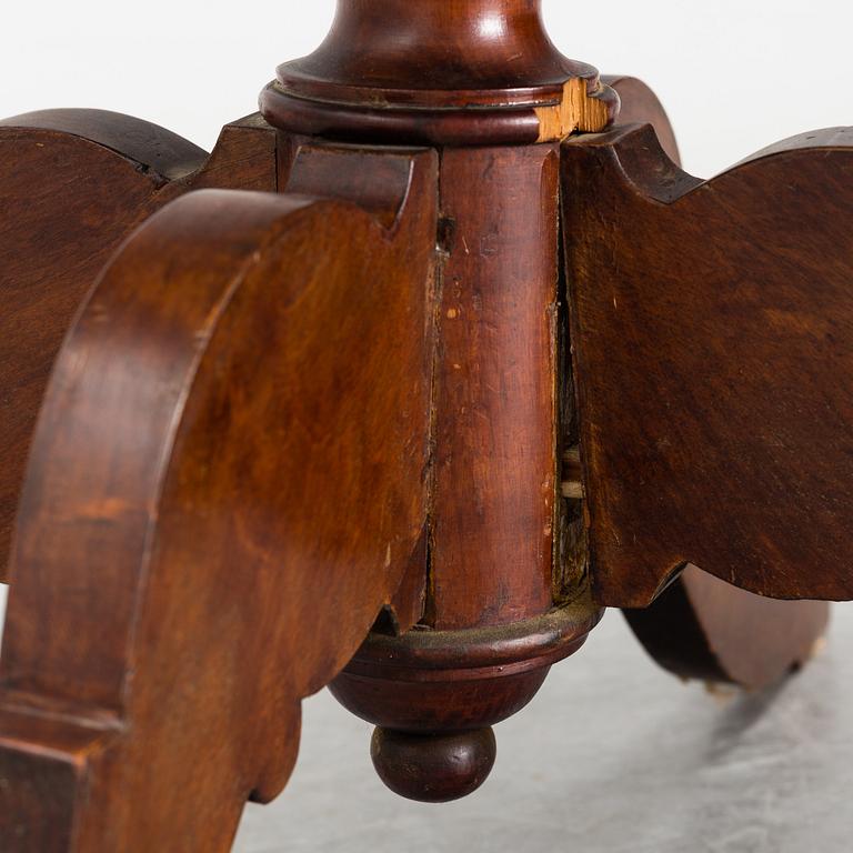 A 19th century tilt top table.