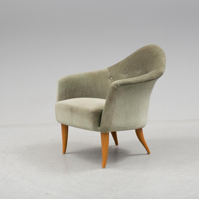 A easy chair "Lilla Adam" by Kerstin Hörlin-Holmquist.