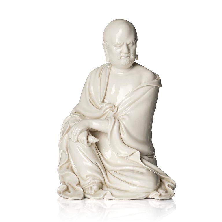 A blanc de Chine seated figure of Bodhidharma, Qing dynasty.