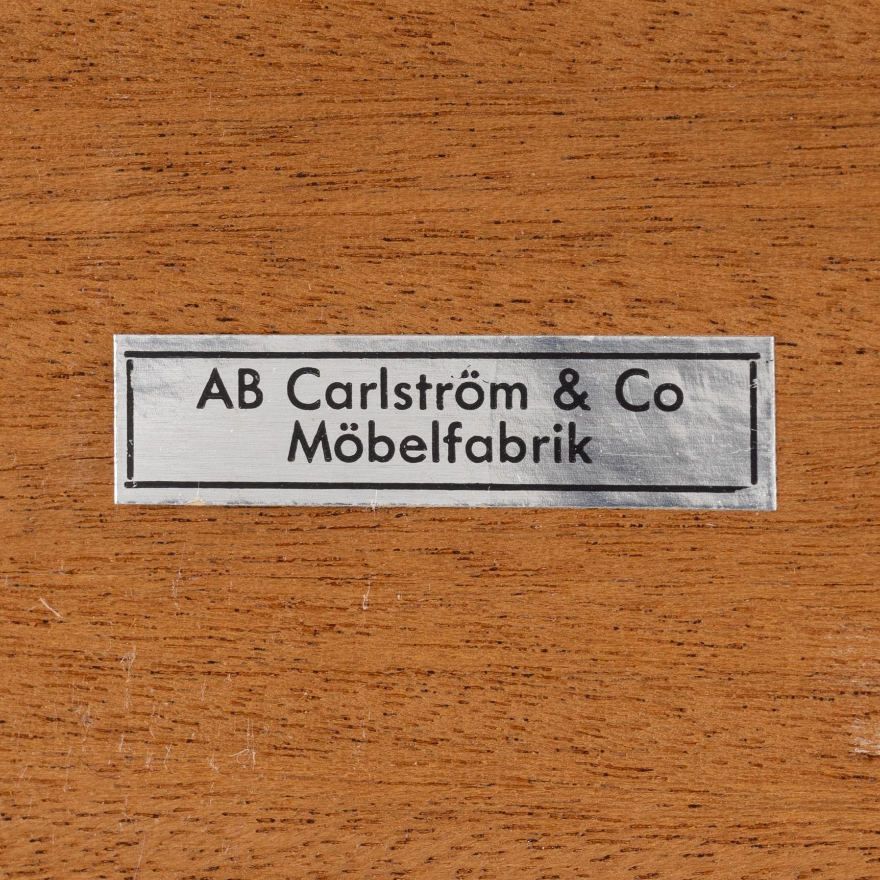 A pair of teak veneered bedside tables, 1960's.