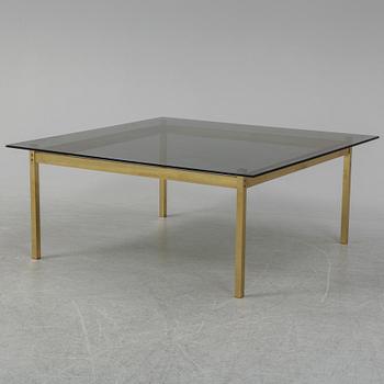 A 1960-70's brass and glass coffee table.