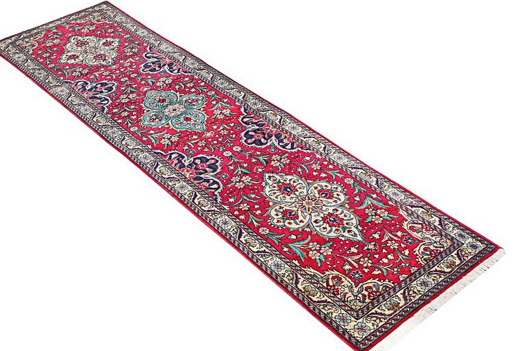 A runner carpet, Tabriz, c. 402 x 88 cm.