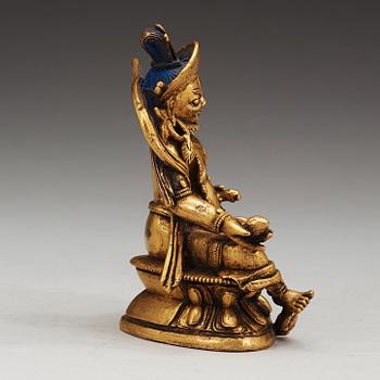 A Sino-Tibetan gilt bronze figure of Kubera, 18th Century.