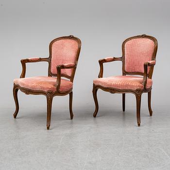 A pair of 19th-century rococo revival arm-chairs.