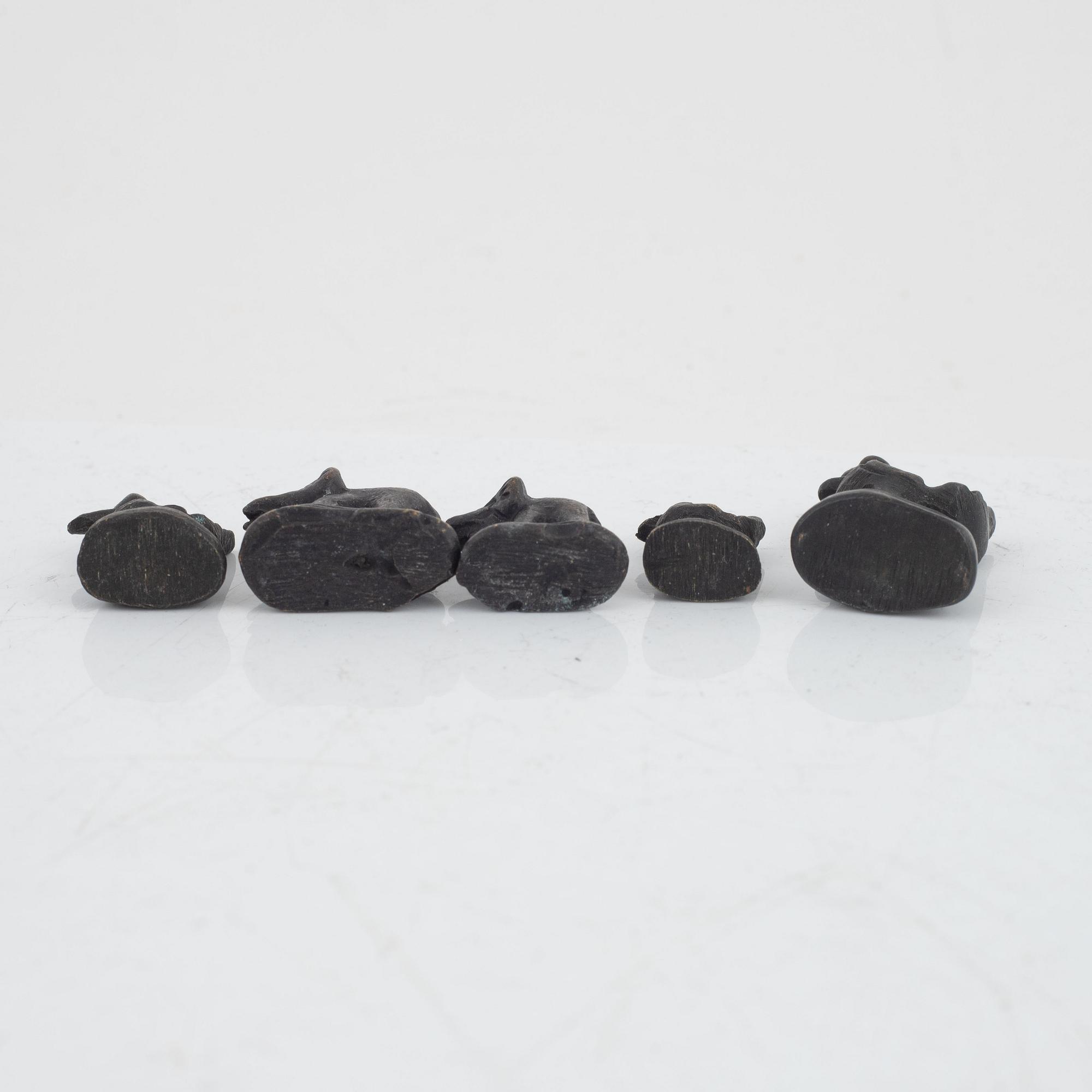 Nine bronze opium weights, Burma, 19th/20th century.