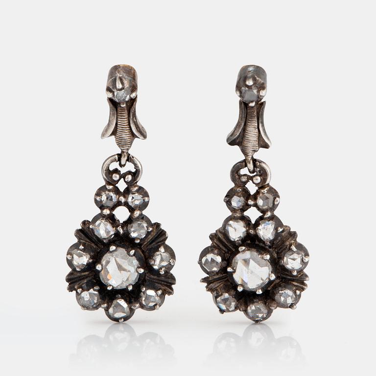 A pair of silver and 18K gold earrings set with rose-cut diamonds.