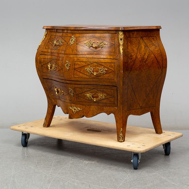 A mid 20th century rococo style chest of three drawers.