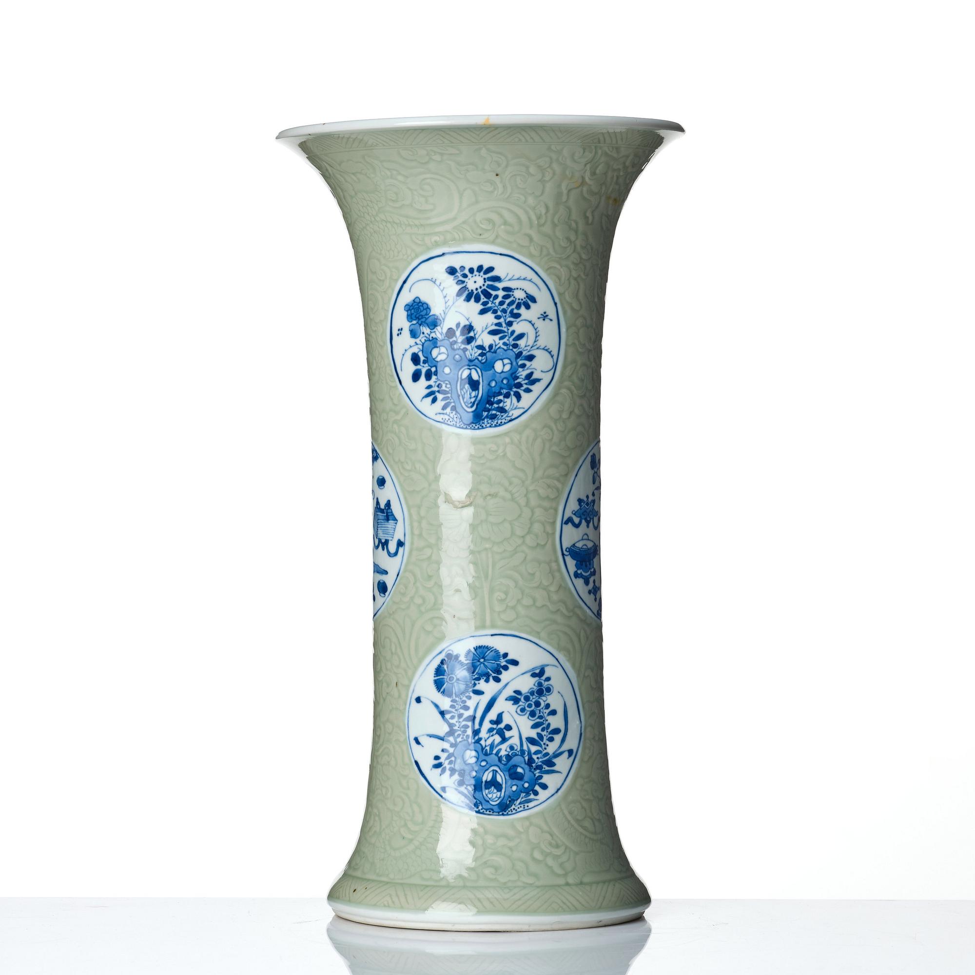 A Chinese blue and white celadon-ground beaker vase, Qing dynasty, Kangxi (1662-1722).