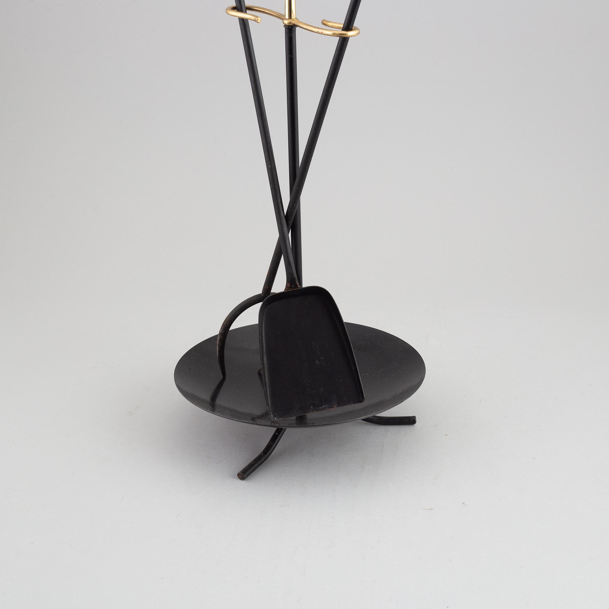 A fireplace stand of three parts by Gunnar Ander for Ystad Metall.