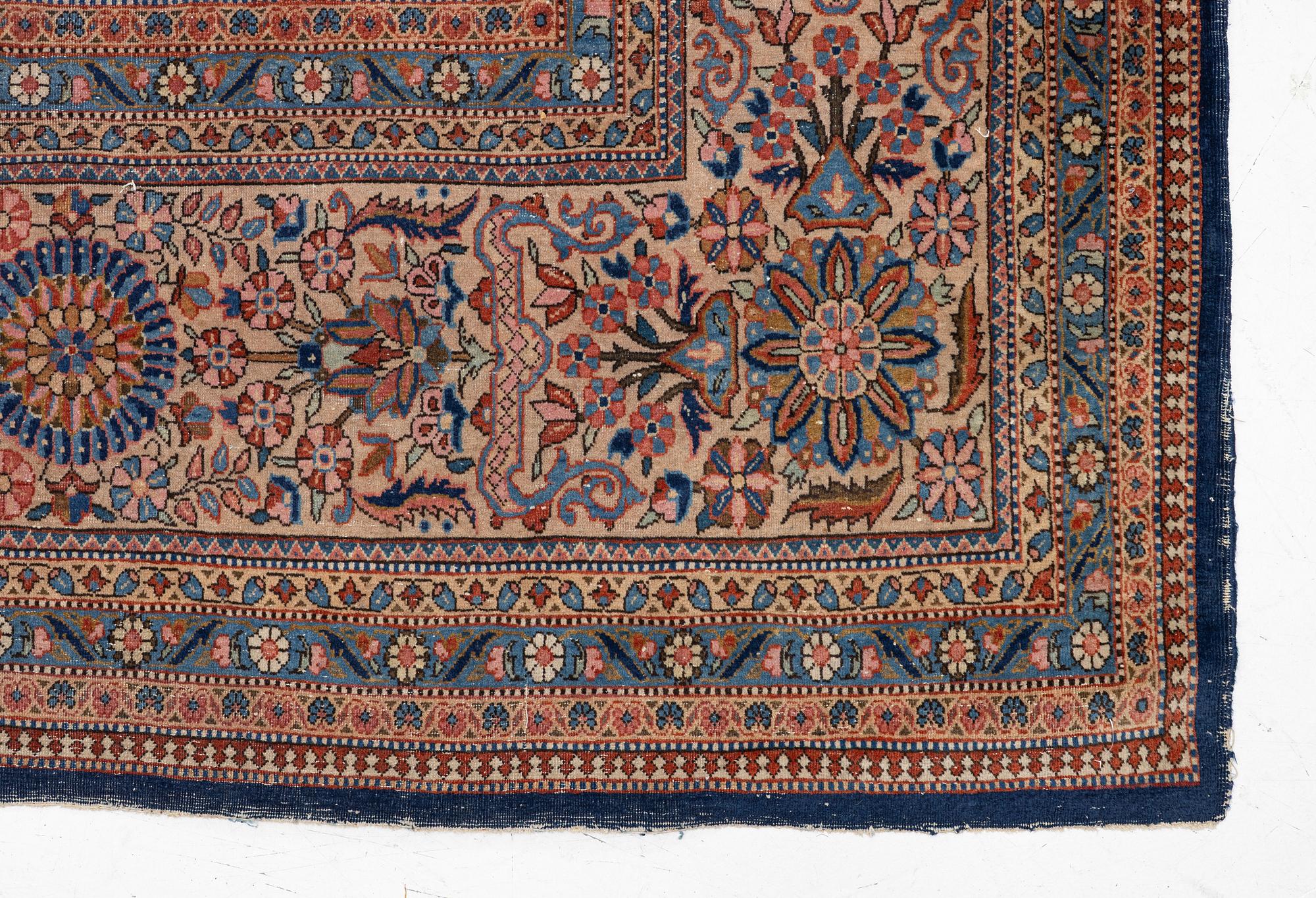 An oriental carpet, c. 425 x 305 cm.
