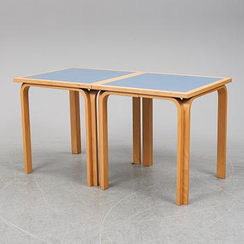 Table with four chairs, late 20th Century by Magnus Olesen.