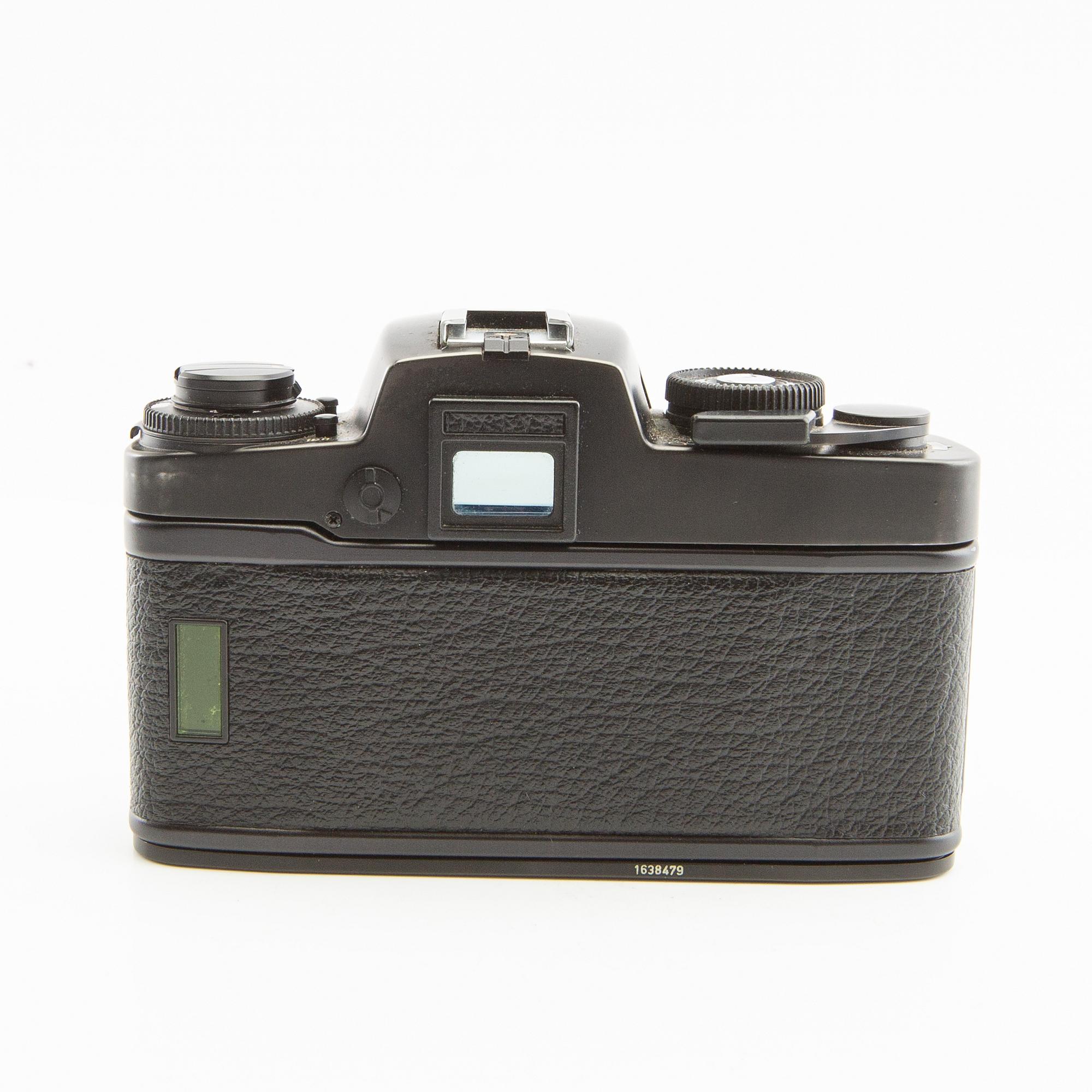 Leica R4s camera body, lens, and accessories.