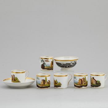 A group of seven cups, one with dish, Germany and France, 19th century.
