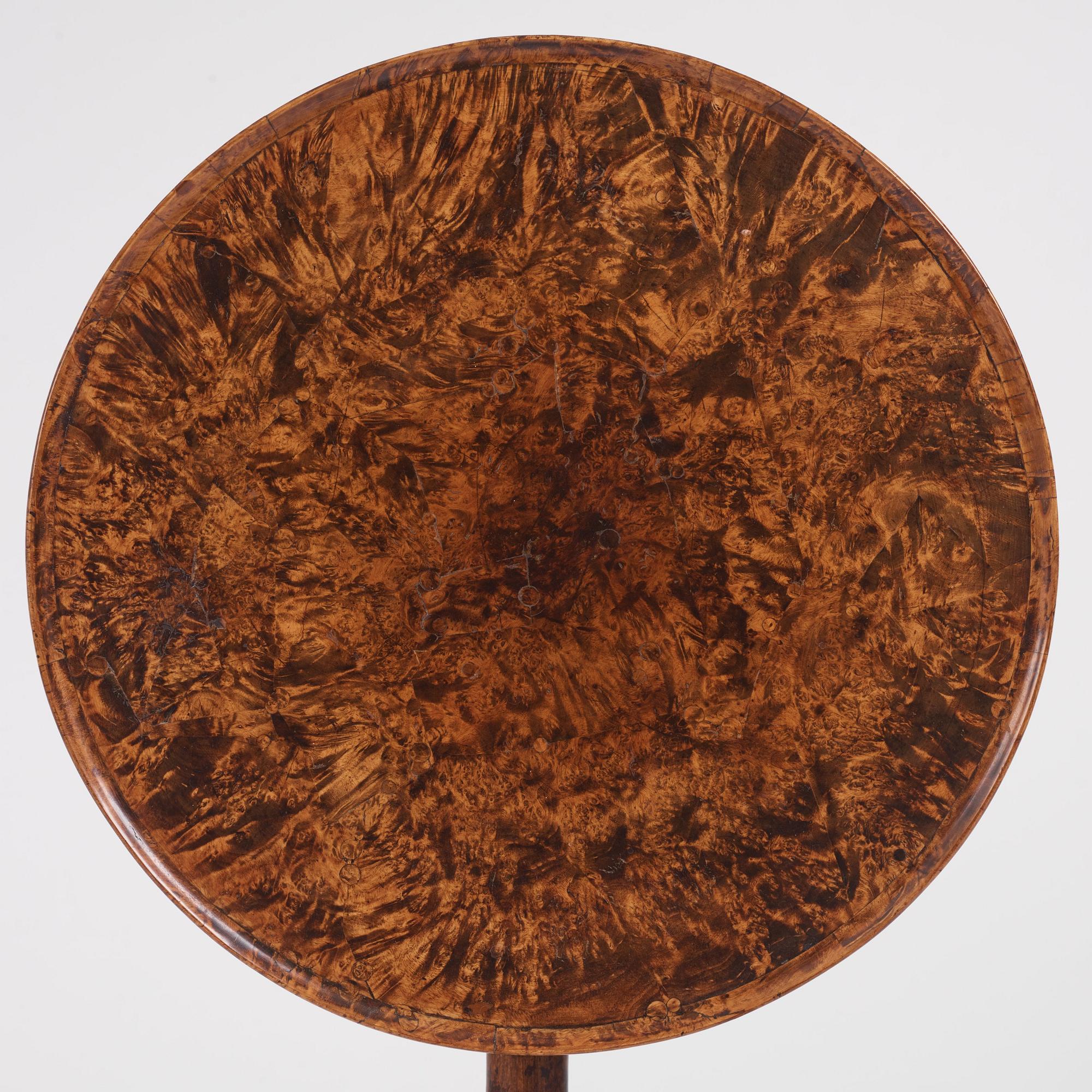 A burr-alder tilt-top table by J. Sjölin (master 1767-1785).