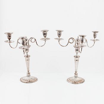 A pair of silver plated candelabra/candlesticks, England, first half of the 20th Century.