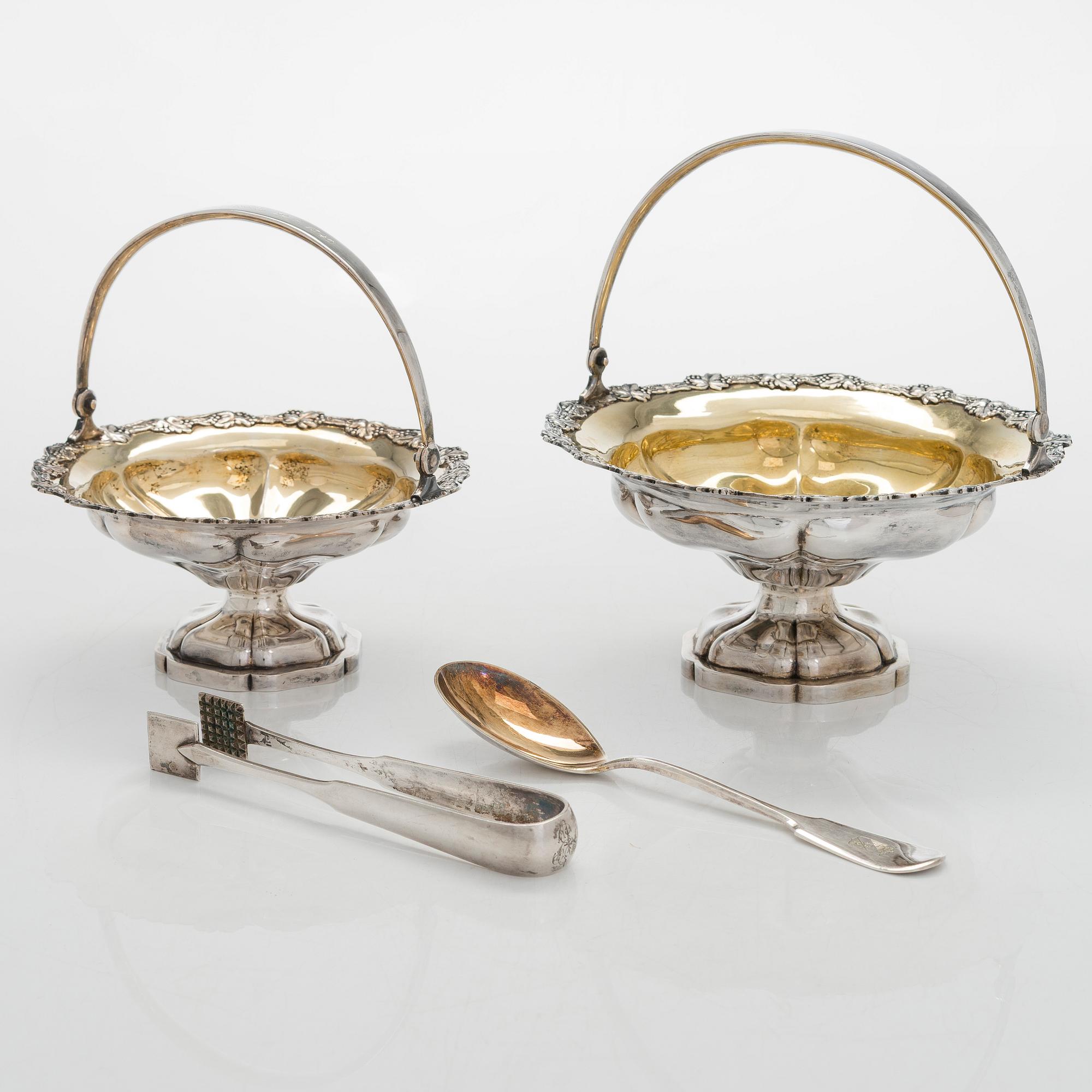 A set of two 1920s-1930s silver sweetmeat basket with sugar tong and jam spoon, Uusi Kultaseppä Oy, Helsinki, Finland.