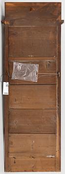 An Empire style mirror, second half of the 20th century.