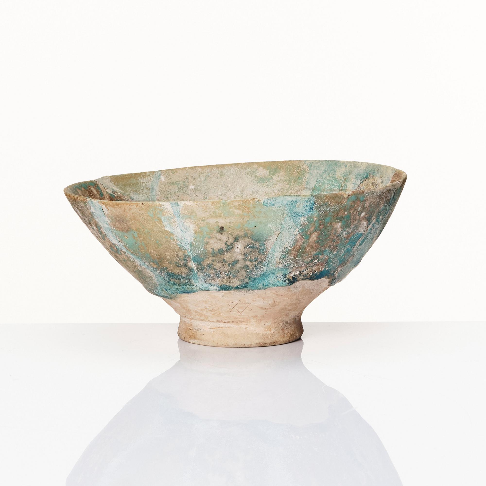 A 10-11th century Kashan Turquoise-glazed pottery bowl.