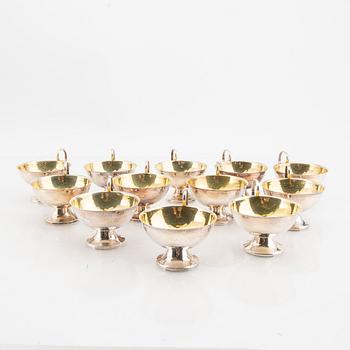 A Swedish set of 12 silver cups mark of K&E Carlson Gothenburg 1948, weight 382 grams.