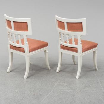 A gustavian style table and six chairs. First half of the 20th century.