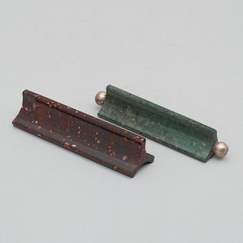 Two Swedish porphyry 19th century knives rests.