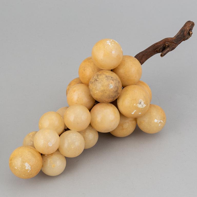 13 stone table decorations of grapes, 20th century.