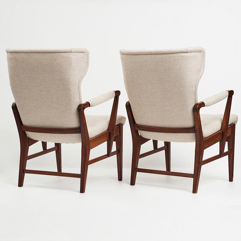 Bertil Söderberg, a pair of mahogany Swedish Modern easy chairs, Nordiska Kompaniet, 1940's.