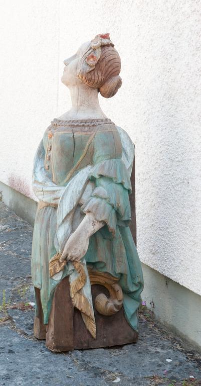A WOODEN FIGURE- HEAD,