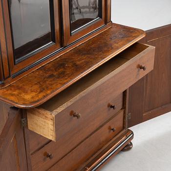 A mahogany veneered book cabinet, around 1900.