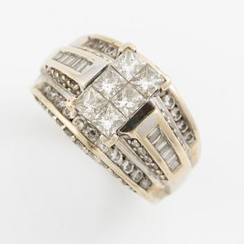 Ring, 14K gold with princess, baguette, and round brilliant-cut diamonds.